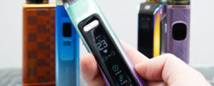 Person adjusting wattage on a box mod device